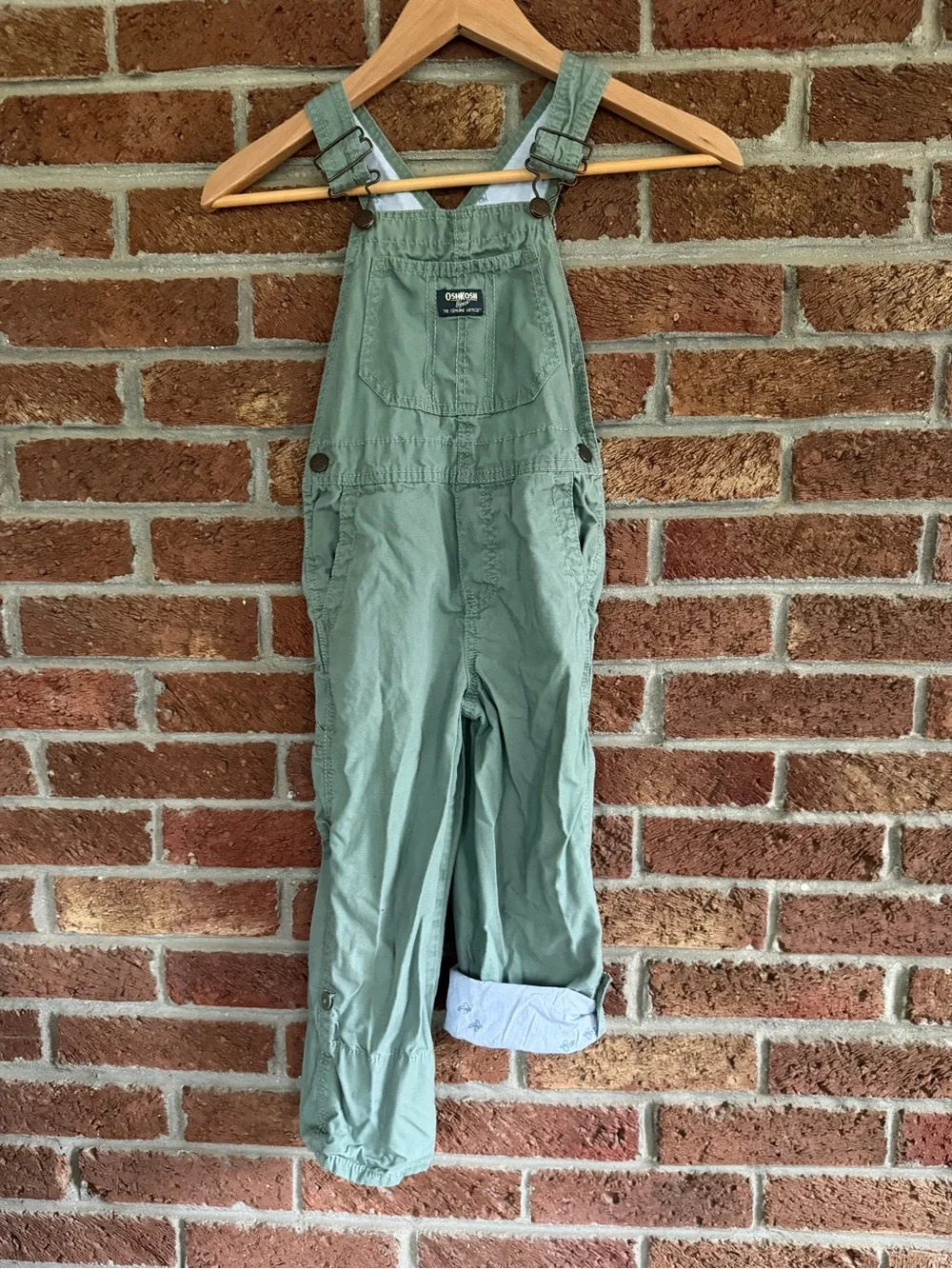 OshKosh B'gosh Kids Green Overalls. Airplanes on inside.  5T size.